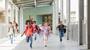 Elementary kids running to class
